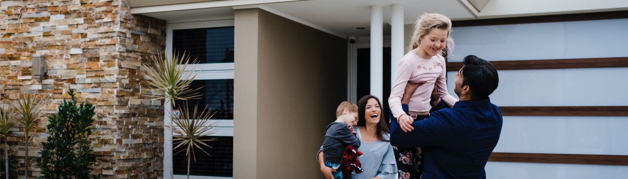 Family outside home - 2100 x 600